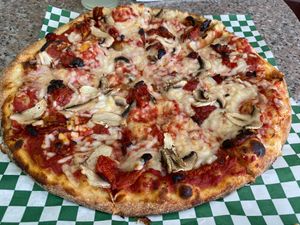 Cheese pizza with sun dried tomatoes and mushrooms  at Gegen in Los Angeles