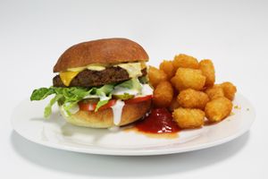 Queen burger with tots  at Gegen in Los Angeles