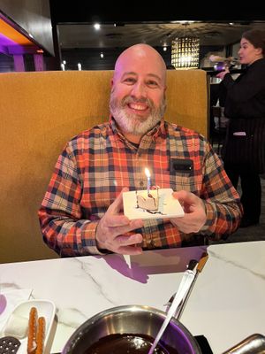 Hubby's birthday so a candle in his cake   at The Melting Pot in King Of Prussia
