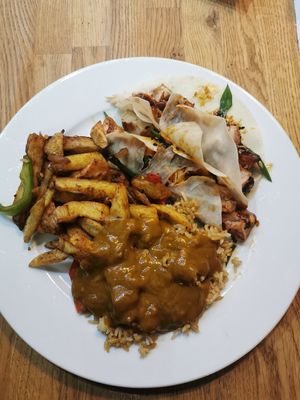 Salt and pepper chips, plain fried rice, curry and jackfruit pancakes. Pancakes are really nice just a bit messy! at Woo Tan Scran - Cloud Kitchen in Liverpool