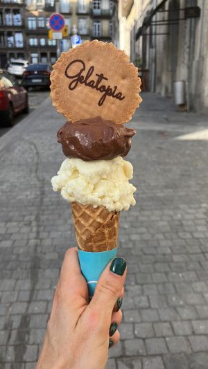 Chocolate and pina colada vegan ice cream. Cone and cookie not vegan.  at Gelatopia in Porto