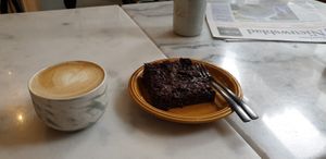 Cappuccino with oath milk and vegan brownie at Mica Coffeebar in Haarlem