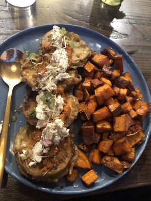Gluten free vegan crispy eggplant : whipped almond ricotta , fire roasted red pepper and tomato , ajvar fresh basil and side of Caesar salad   at The Wild Feast Cafe in Rockville Centre