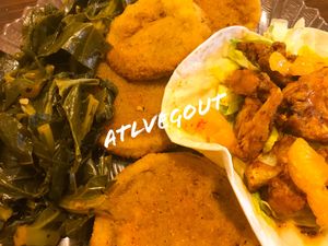 Cauliflower taco, fried green tomatoes and collard greens  at Trend Urban Cafe in Stone Mountain