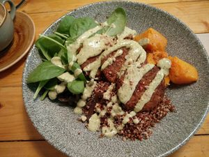 Vegan Buddy bowl with quinoa, lentils, onions, falafel, sweet potatoes at Menssana in Barcelona