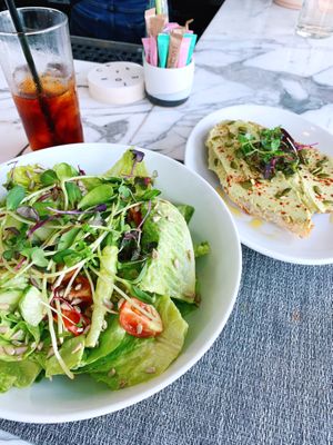 Green goddess salad, cold brew, and avocado toast at Cafe Roze in Nashville