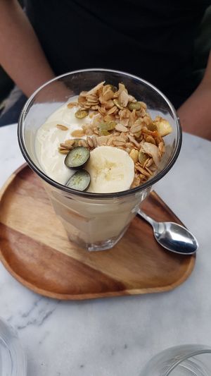 Coconut yoghurt with banana and granola at HART in Antwerpen