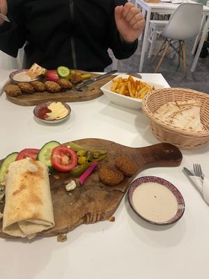 Our entire order. Sesame falafel which comes with naan, special sandwich and chips  at Falafel en Hummus in The Hague