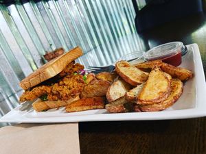 Delicious “Chick’n Sandwich" (it’s actually mushroom!) with Fries from SOVeganly.   at SO Veganly in Spring