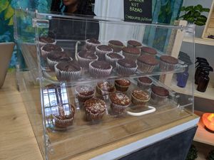 Baked goods case. Banana bread muffins, some chocolate, with or without nuts. at SO Veganly in Spring