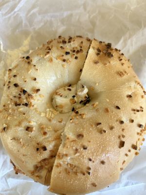 Onion toasted bagel with vegan veggie cream cheese  at Seaford Bagels in Seaford