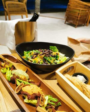 Kale and chickpea salad and a vegan cheese platter at Halapua by Kapuhala in Koh Samui