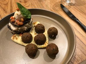 My favorite dish "eggplant".  Eggplant slices layered with "cheese" and super yummy falafels on the side.  at Halapua by Kapuhala in Koh Samui