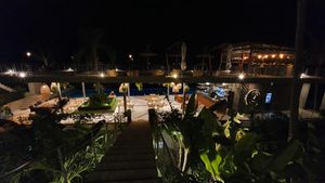 Evening. Looking from reception to the restaurant and rooftop bar, at Halapua by Kapuhala in Koh Samui