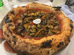 Vegan pizza with vegetables  at Bella Napoli in Bergamo