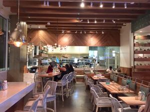 Stylish dining room with open kitchen in rear.  Ample outdoor dining also available. at Tocaya Modern Mexican - Fashion Square in Scottsdale