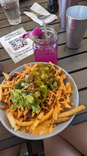 Carne asada fries and dragon fruit lemonade 🍋 at Vegan Avenue in San Antonio