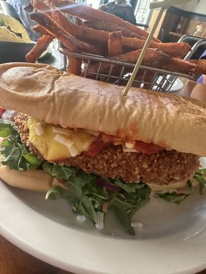 Chicken parm sandwich with sweet potato fries   at Vegan Avenue in San Antonio