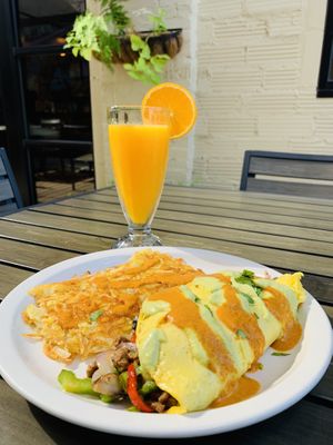 CheezeSteak Omelet with red and green salsa. Freshly squeezed OJ. Shaded patio. #home at Vegan Avenue in San Antonio