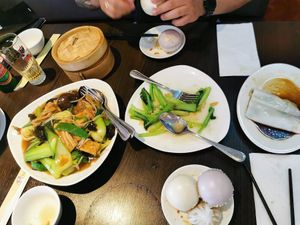 Rice noodles, greens and tofu, greens and garlic, rice noodle roll, and steamed buns at Full Moon Garden in Amsterdam