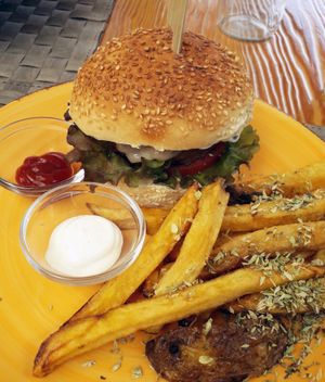 "Be kind" burger (with cheese) and some fries at Mundo Vegan - Vegan World in Funchal