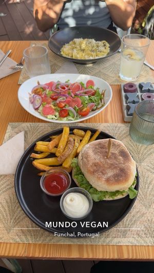 Burger with fries and side saladd  at Mundo Vegan - Vegan World in Funchal