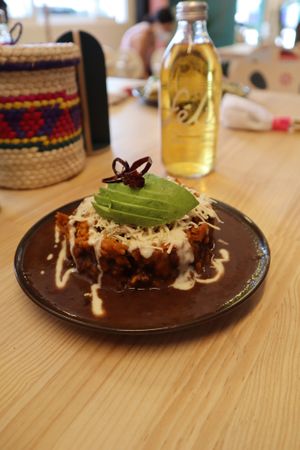 FIDEO OAXAQUEÑO: Fideo seco con adobo de chile pasilla oaxaqueño y hoja de aguacate, salsa de frijol al chipotle, crema vegana, queso fresco vegano, aguacate y chile frito.  at Pali Pali del Valle in Mexico City
