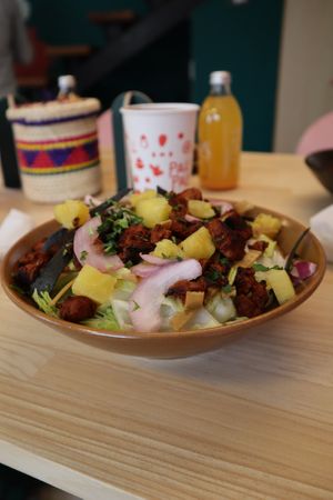 ENSALADA DE PASTOR: Lechuga mantequilla, pastor de soya, piña asada, cebolla morada dulce, crujiente de tortilla, cilantro y vinagreta de pastor.  at Pali Pali del Valle in Mexico City