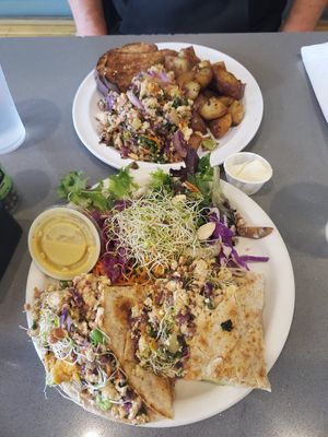 Tofu Scramble (top) and Tofu breakfast burrito with side salad & nutrional yeast dressing at The Manatee Cafe in St Augustine