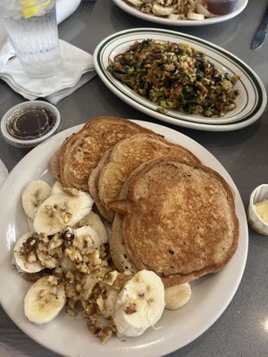 vegan pancakes came w bananas & walnuts; loaded tofu scramble 😍  at The Manatee Cafe in St Augustine
