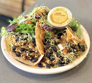 Burrito #2 with a salad and nutritional yeast dressing:) at The Manatee Cafe in St Augustine