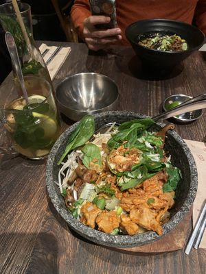 Green Ansan Bibimbap with planted chicken + homemade ginger tea. (the other dish is spicy tantanmen ramen soup with planted beef)  at Miss Miu - Europaallee in Zurich