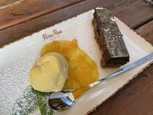 „Luftikus“ dessert: Mousse au Chocolate with mango icecream and peach sauce at Peter Pane - Leuchtturm in Rostock