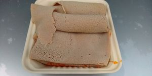 Ethiopian bread with tofu underneath it. at Nile Vegan in Columbus