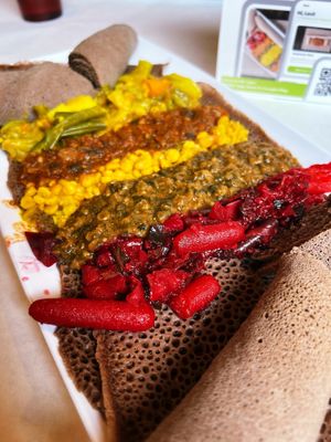 Half Garden Plate with beet and vegetable medley, okra and red lentils, yellow split peas, mushroom, and curry vegetable medley.   at Nile Vegan in Columbus