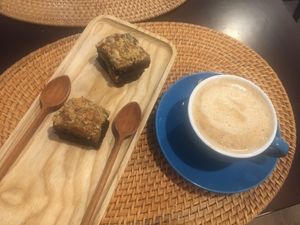 Chocolate brownie with peanut sauce and a cappuccino  at The Cookiss in Da Nang