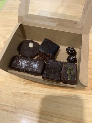 Almond chocolate cookie, brownie, date and tahini chocolate, bounty, twix and pumpkin truffle - overall pretty good! at The Cookiss in Da Nang