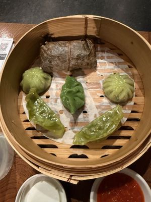 2 spinach & mushroom gyoza, 2 spicy vegetable dumplings, mushroom & leek dumplings, and vegetable sticky rice (all part of the vegan set)  at Ping Pong Dim Sum in London