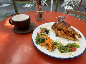 Dirty chai and breakfast croissant   at Vegamo Deli in Mexico City