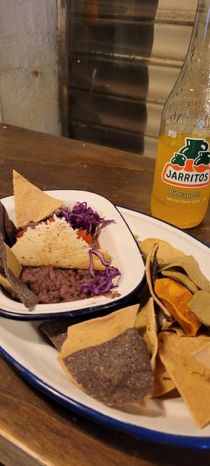 Refried black bean and pineapple Jarritos at Monchito in Barcelona