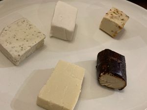 Clockwise from top left: dill havarti, mozzarella, hatch chili pepperjack, truffle chevre, and gruyere at Rebel Cheese in Austin