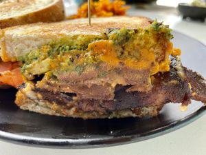 Grilled cheese with bacon, tomato, avocado and pesto on sourdough bread.  at Rebel Cheese in Austin