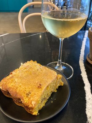 Pumpkin coffee cake from the Cake Thieves and happy hour house white wine at Rebel Cheese in Austin