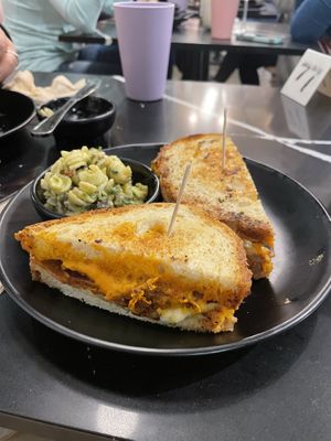 Grilled cheese with bacon and a side of pesto pasta   at Rebel Cheese in Austin