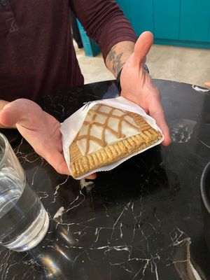 Giant apple pop tarts (hands for scale!) at Rebel Cheese in Austin