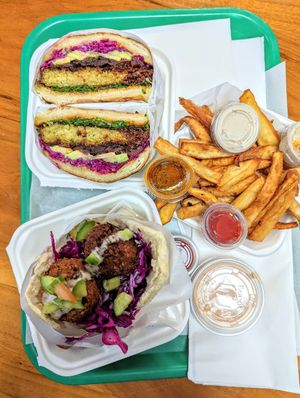 Kale FalaBurger and Traditional Falafel in Pita Bread with Sweet Potato Fries at Fala Bar in Santa Barbara