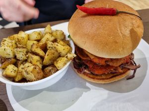 Burger with hash potatoes at Vegivores in Reading