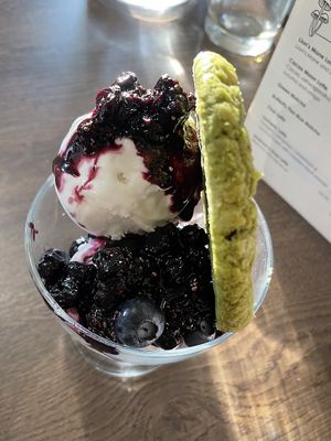 Coconut ice cream, berry compote, matcha and white chocolate cookie  at Vegivores in Reading