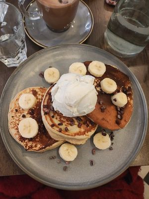 three pancakes with banana, cocoa nibs, and ice cream (i asked later to add chocolate sauce too and they did) at Vegivores in Reading