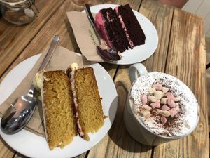 Victoria sponge, chocolate and raspberry cake and hot chocolate with cream and marshmallows  at Vegivores in Reading